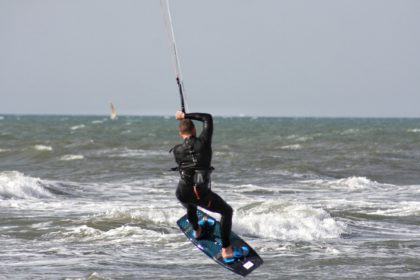 Man doing kite surfing i the sea