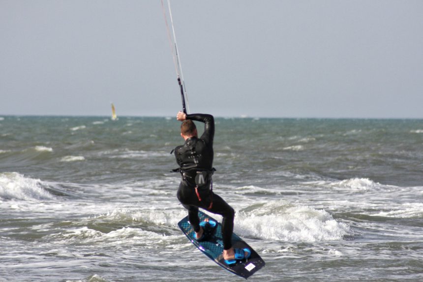 Man doing kite surfing i the sea