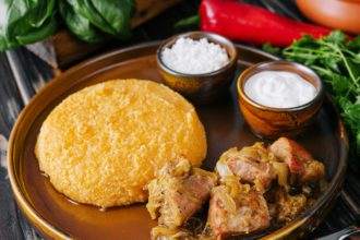 Traditional Moldavian, Romanian cornmeal porridge with meat and sauce